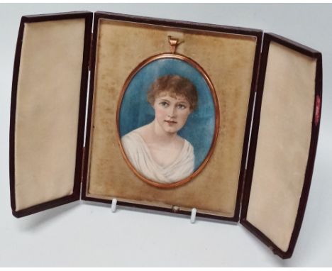 Portrait Miniature - A late 19th/early 20th century oval miniature of a young lady in a yellow metal frame, 11.6 x 8.6cm, in 