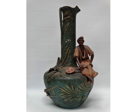 Austrian Ceramics - A polychrome vase and figure of a seated blackamoor with a lute, height 48.5cm.