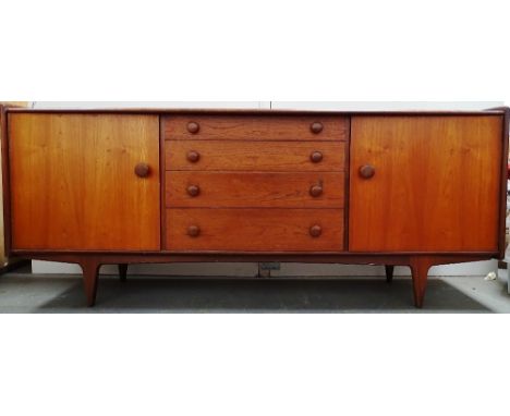 A. Younger Ltd - An afromorsia sideboard, comprising of four graduated short drawers, the top one with cutlery divisions, fla