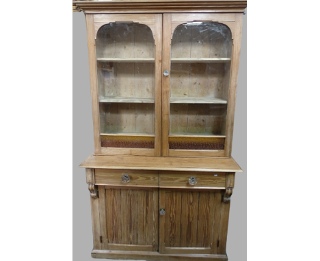 Victorian Glazed Pine Dresser - A late Victorian, two door glaze fronted dresser opening to reveal three drawers lower, one l