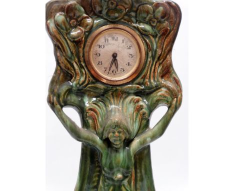 Art Nouveau Ceramic Cased Clock - Green glazed and marked G 1914 within, having a figure in a diaphanous dress with floral mo