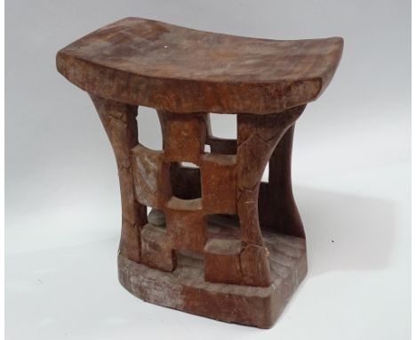 Ethnographic Native Tribal - A carved hardwood stool with chequer like decoration and hollow central section, height 25.5cm, 