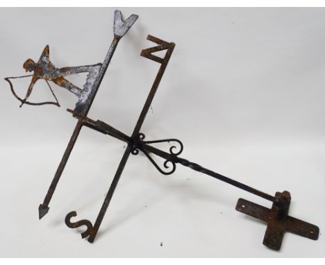 Wrought Iron - A weather vane in the form of an archer with longbow, with wall mounting bracket, height 90cm approximately. 