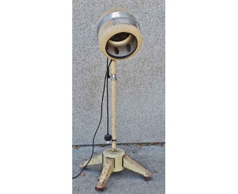 1950s Retro - An electric floor standing hair dryer with chrome and cream livery, inscribed 'Magic Supercharger', on a four f