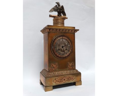 19th Century French Mantle Clock - A gilt brass clock with an eagle surmounting a canon above a case with laurel chaplets, st