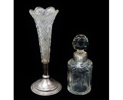 A silver collared cut glass bottle and stopper, Birmingham 1909, maker's mark for Charles May? and a cut glass epergne with s