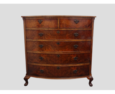Walnut Chest - A circa 1925 walnut breakfront chest of two short over four long graduated drawers with crossbanded and quatre