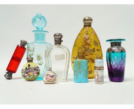 Scent Bottles - A collection to include a dark amber screw top bottle with hand painted enamel decoration of flowers and a bu