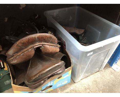 Two boxes of horse riding tack including a saddle 