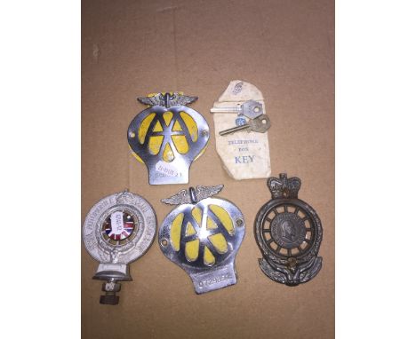 Four automobile car badges comprising two Royal Autombolie Club and two AA, together with two RAC telephone box keys in origi