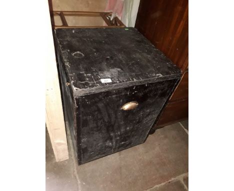 A vintage lidded trunk with twin brass handles 
