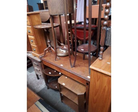 Seven items of furniture comprising an inlaid desk/console table, two plant stands, two occasional tables, a tripod table and