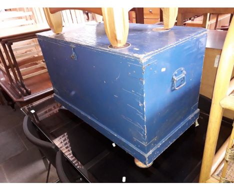 A large blue painted wooden trunk with handles 