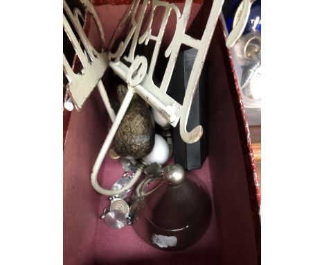 A tub of mixed items inc lighter, old His &amp; Hers hangers, ethnic figure, etc. 