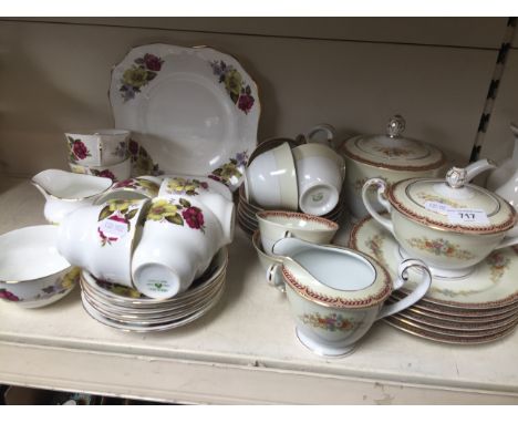 2 floral tea sets, one including teapot 
