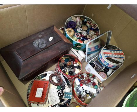 A box containing tins of haberdashery, buttons etc, including a wooden tea caddy of sarcophagus form (as found) 