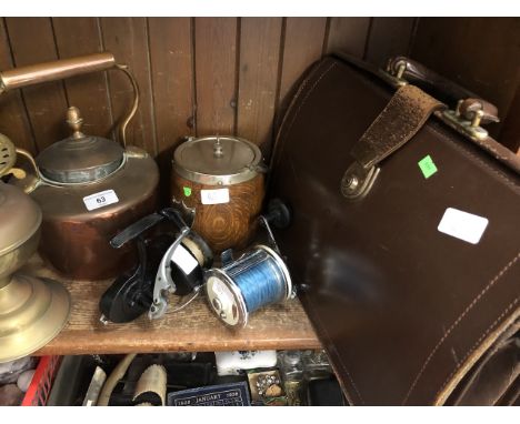 Various mixed items including copper kettle, brass lamp, mounted biscuit barrel, two fishing reels and leather bag. 