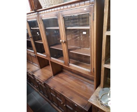 An Ercol Golden Dawn glazed top dresser 