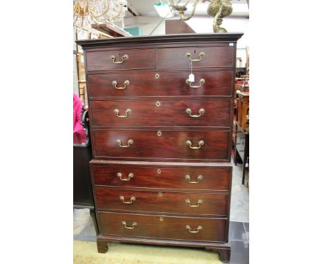  A George III mahogany chest on chest, the upper section with two short over three long drawers, the base section with three 
