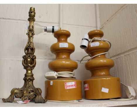 A pair of 1970's standard lamps together with an ornate brass standard lamp (3)Please note: this item is being sold for decor