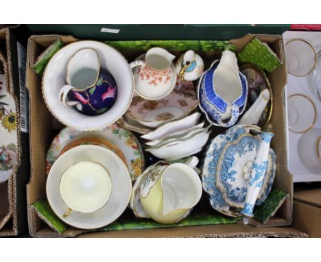 A 20th Century Royal Worcester tea bowl and saucer, together with a Royal Crown Derby 'Posie' pattern vase, a Royal Crown Der