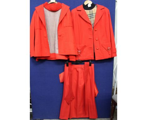 A Grossfell red mac by Grenfell three quarters - a green velvet jacket and skirt by John Comery - Long Eaton and green check 