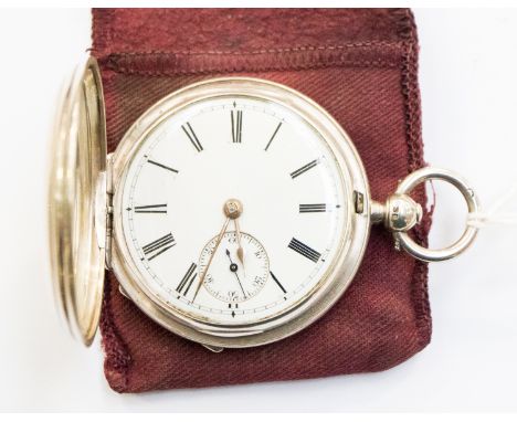 A silver hunter pocket watch London 1880 with key and pouch enamel dial and Roman numerals
