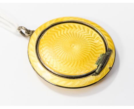  An Asprey and Garrard, enamelled silver compact, round form with yellow guilloche enamel, approx diameter 45mm