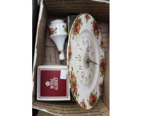 A set of six, bone handled, silver plated knives and forks, together with a Royal Albert, 'Old Country Roses' clock, vase and