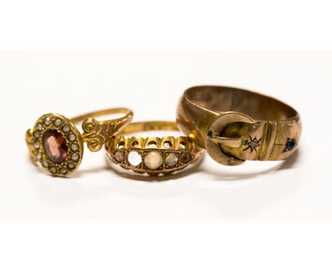 A Victorian garnet and seed pearl 9ct gold clusters ring, a Victorian opal 9ct gold ring a/f, and a 9ct gold gem set buckle r