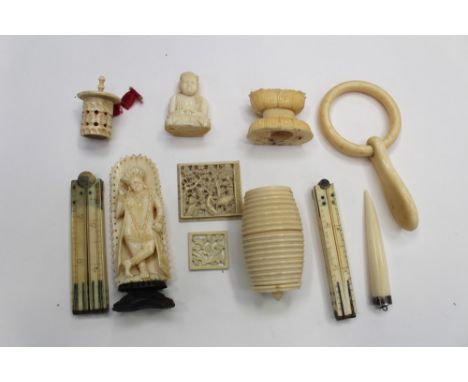 Two ivory measures, together with an ivory baby's ring, a bobbin holder, a tape holder, two small square carved ivory pieces,