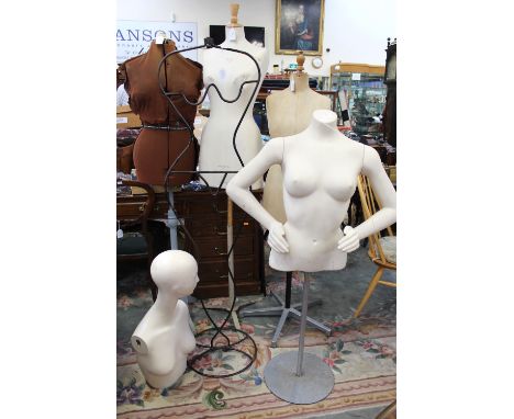 A 1920/30s tailors dummy on a modern stainless steel stand; together with a head and torso mannequin top (no arms) and a mann