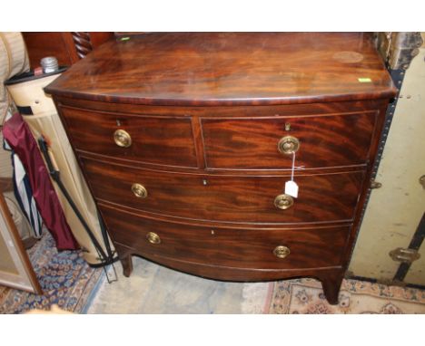 A George III mahogany chest of drawers, of bow fronted form, fitted with two short over two long drawers, bracket feet