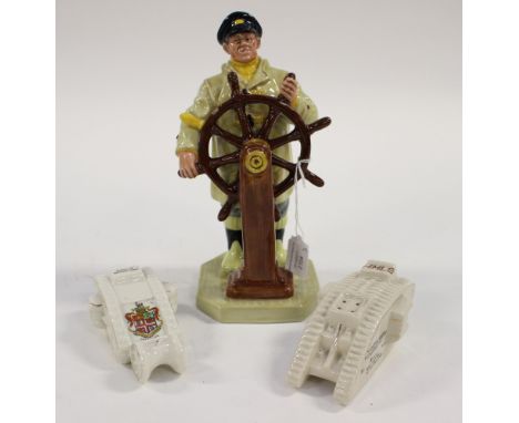  A Royal Doulton figure 1973 HN 2499, the 'Helmsman' together with two World War One tanks, the Marine 1918 Carlton ware and 