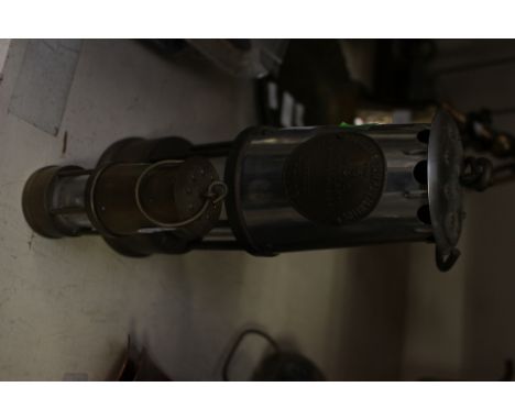 A miners lamp and miniature 