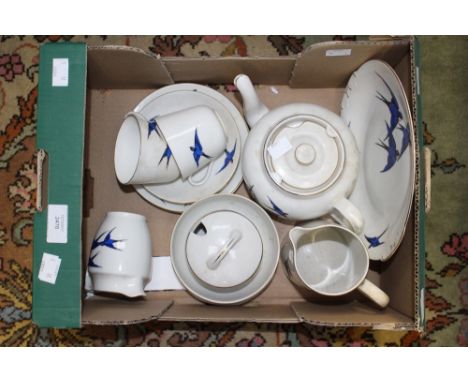  Box containing tea service for two, decorated with blue birds comprising tea pot, milk, sugar, cream, bread and butter plate
