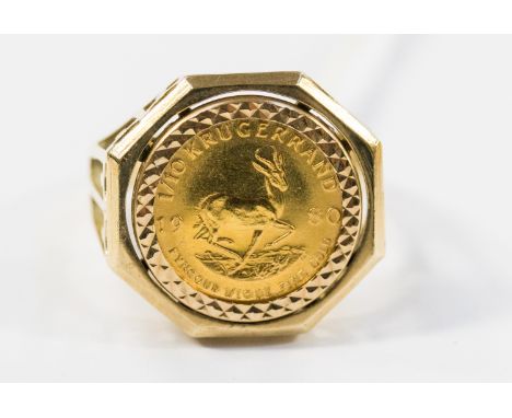 A 9ct ring, set with a Krugerrand, weighing approx 8.1 grams 