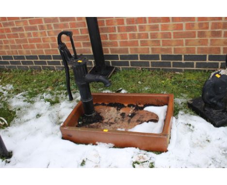 A collection of garden items, comprising well with water integrated waterpump, floor standing flower basket, a stoneware barr