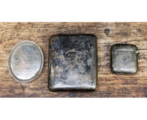 A silver cigarette case, 2.38 ozt; a silver vesta, 0.77  grams and a white metal award to Boreas Curling Club 1871, 1.68 ozt 