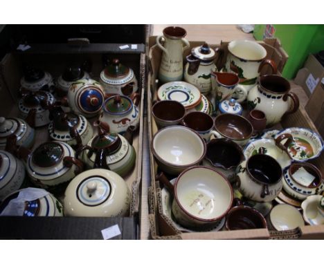 Large quantity of Torquay pottery, including teapots, match strikers, pickle dishes, egg cup, bowls, loving cups, jugs plates