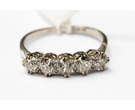 A five stone diamond half eternity ring, each one claw set, set in platinum, approx diamond weight 1 carat, finger size P1/2 