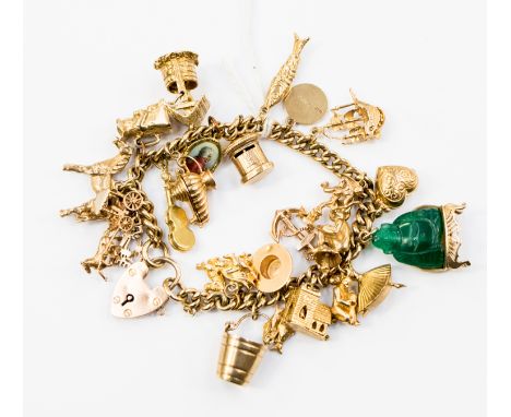 A 9ct gold charm bracelet, with various charms such as a jade Buddha, a ballerina, an articulated fish and a horse etc, with 