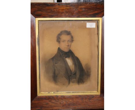 English School, mid 19th Century, portrait of a young gentleman, half length, pastel, 30cm by 24cm, in the original rosewood 
