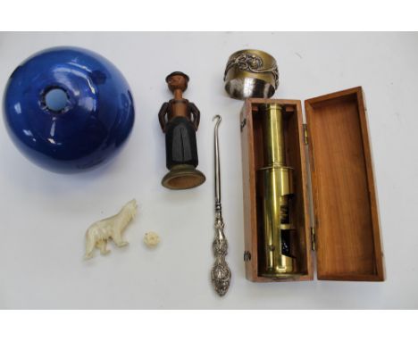 Collection of curios including silver hook, ivory bear and ball, boxed scientific scope, glass float, brass ring and folk art