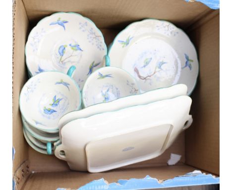 A large thirty eight piece tea service by Grosvenor china - retailed by Jackson and Gosling, circa 1920s, hand painted with b