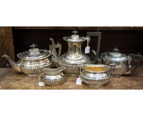A five piece, silver plated tea service comprising of tea, coffee and hot water pots sugar and milk 