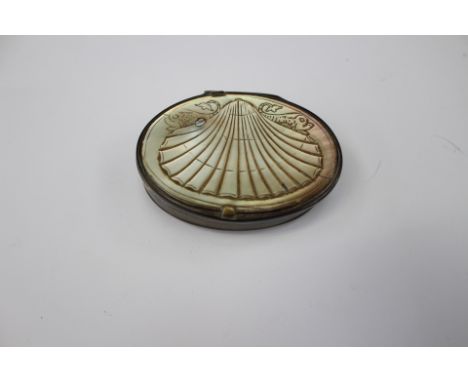 A George IV snuff box with mother of pearl top, with dolphin and shell pattern