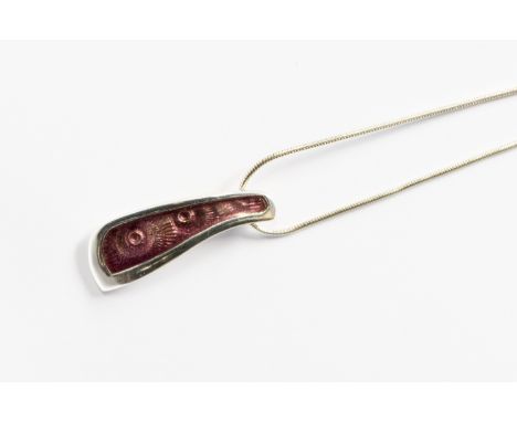 One silver and enamel pendant by Malcolm Gray for Ortak, with stylised fossil detail overlayed with pink enamel, on a snake c