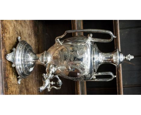 A Victorian EPNS engraved large tea urn, on circular base with four scroll feet, detachable cover with flame finial 