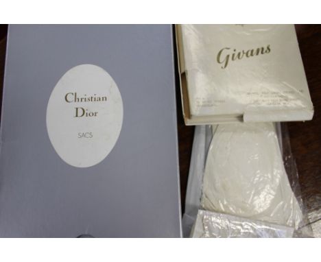 A Christian Dior wash bag with zip (discoloured on both sides) Kidd gloves by Christian Dior - 1950s, lace hankie's x 4 (thre